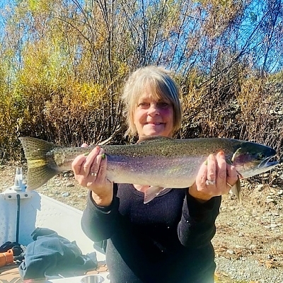 Woman holding up her catch