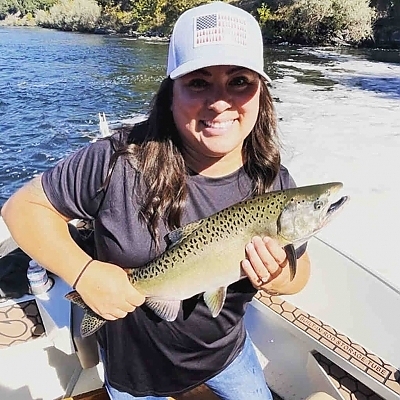 Woman holding up her catch