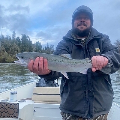  Man posing with trophy catch from fishing trip