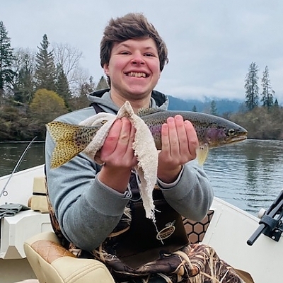 Young teen holding up fish