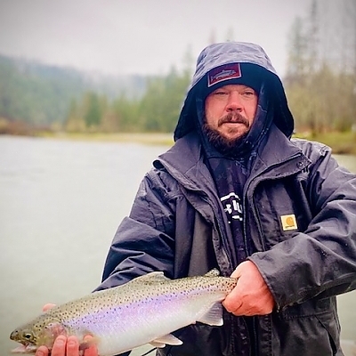 Holding up fish caught in two hands