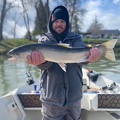 Man showing off catch from trip